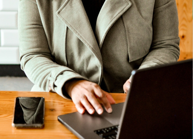 female hands on laptop